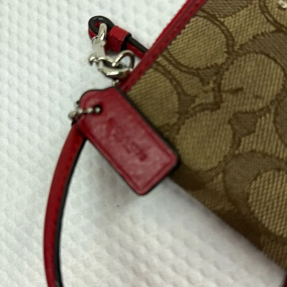 Coach tan and red Wristlet with Logo Pattern